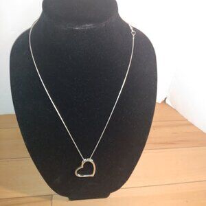 Open heart silver tone necklace.